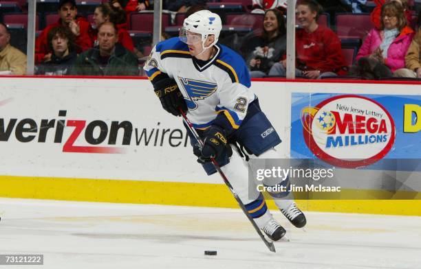 Petr Cajanek of the St. Louis Blues skates with the puck against the New Jersey Devils on January 10, 2007 at Continental Airlines Arena in East...