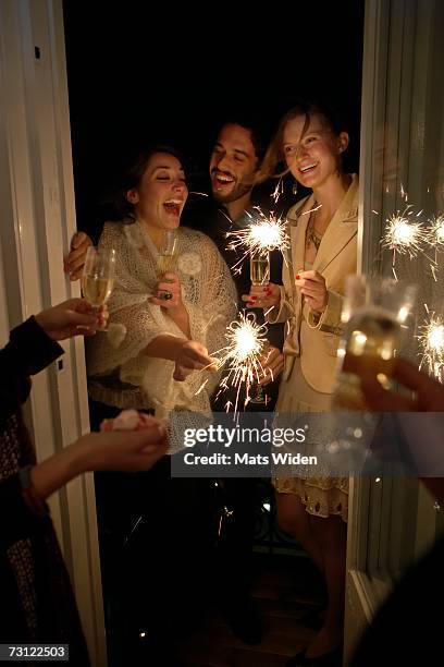 friends at a new years party. - champagne party stock pictures, royalty-free photos & images