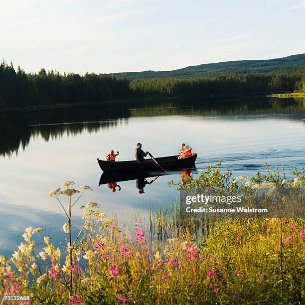 a rowing boat in a lake. - dalarna stock pictures, royalty-free photos & images