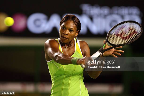 Serena Williams of the USA plays a backhand during her women's final match against Maria Sharapova of Russia on day thirteen of the Australian Open...