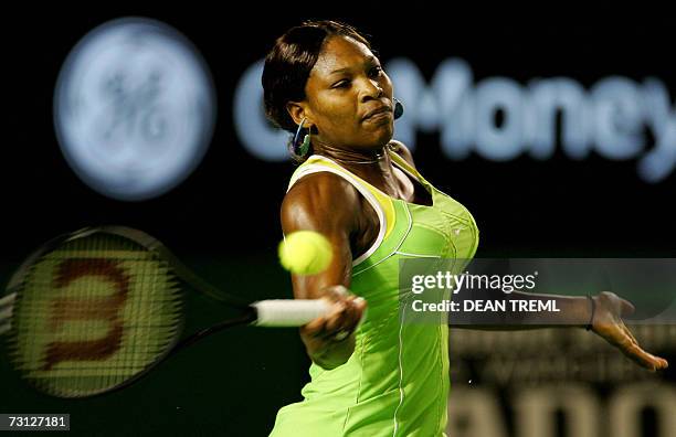 Serena Williams of the US plays a return shot during her women's singles final match against Maria Sharapova of Russia at the Australian Open tennis...