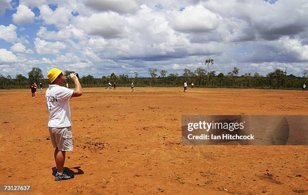 Ben Littlefield drinks a beer whilst fielding at a ground called 'Drinkastubbie Downs' during the Goldfield Ashes January 26, 2007 in Charters...