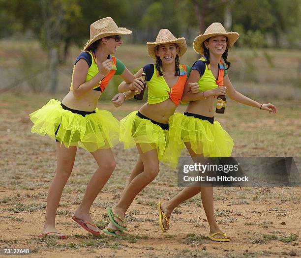 Kendyll Currin, Kristen Paterson and Rebecca Moxham who dubbed themselves 'Tuggas Beer Tarts' bring beers out to competitiors during the Goldfield...