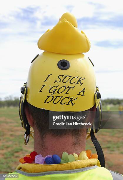 Chad Rosenblatt of the team 'Outcasts' wears a punishment helmet that read 'I suck I got a duck' during the Goldfield Ashes January 27, 2007 in...