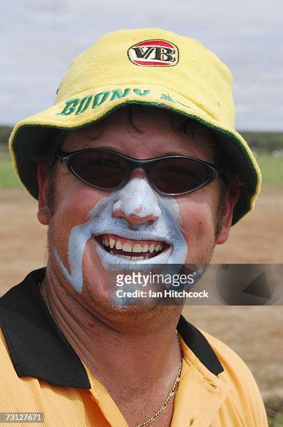 Brad Nicholason of the team 'Coral Coast Marine Madmans' shares a joke with teammates during the Goldfield Ashes January 27, 2007 in Charters Towers,...