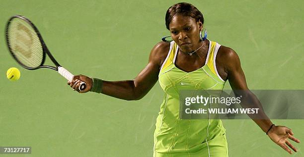 Serena Williams of the US plays a return shot during her women's singles final match against Maria Sharapova of Russia at the Australian Open tennis...