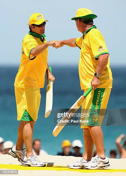 Mark Waugh and Dean Jones of Australia celebrate a six during the Beach Cricket Tri-Nations match on Scarborough Beach January 27, 2007 in Perth,...