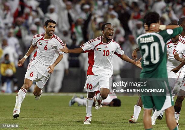 Abu Dhabi, UNITED ARAB EMIRATES: Emirati player Ismail Matar jubilates with his teammates after he scored a goal against Saudi Arabia during their...