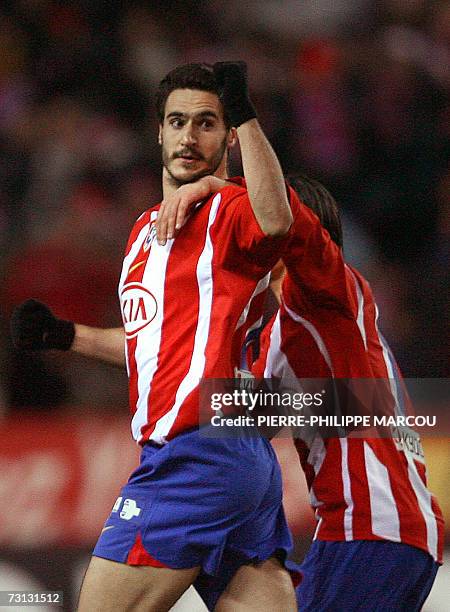 Atletico de Madrid's Spanish defender Pablo Ibanez Tebar celebrates his goal against Racing Santander during their Liga football match in Vicente...