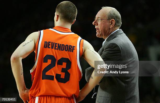 Jim Boeheim the Head Coach of the Syracuse Orange talks with Eric Devendorf during the Big East Conference game against the Louisville Cardinals on...