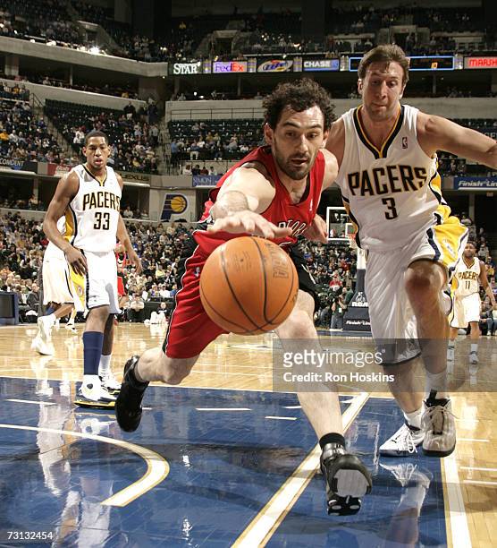 Jorge Garbajosa of the Toronto Raptors battles for a loose ball against Troy Murphy of the Indiana Pacers at Conseco Fieldhouse on January 27, 2007...