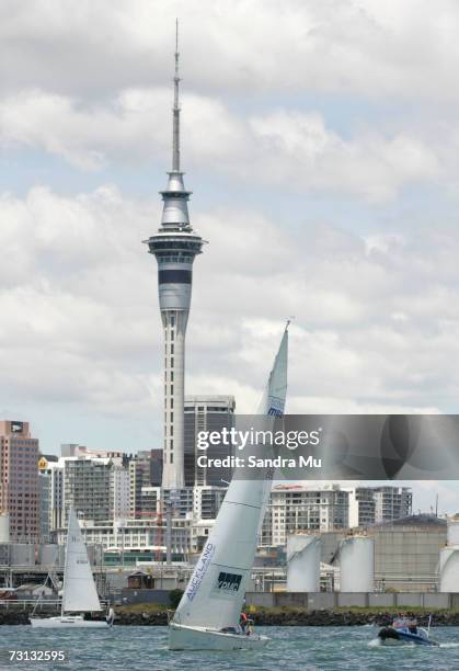 Dean Barker of New Zealand sails past the sky tower during the semi finals of the Auckland Match Racing Cup on Waitemata Harbour January 28, 2007 in...