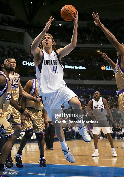 Forward Dirk Nowitzki of the Dallas Mavericks takes a shot against the Sacramento Kings at the American Airlines Center on January 27, 2007 in...