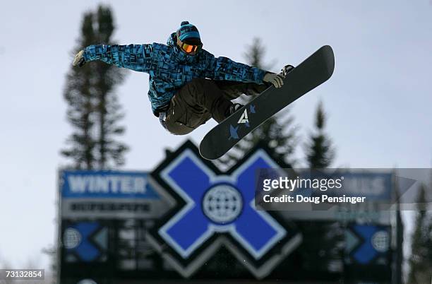 Snowboarder flies high above the superpipe during an open session at the ESPN Winter X Games 11 on January 27, 2007 in Aspen, Colorado.