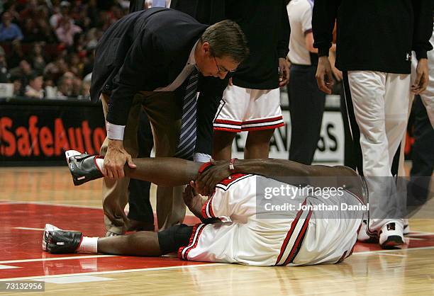 Team trainer Fred Tedeschi of the Chicago Bulls tends to an injured Ben Wallace as he lies on the court against the Miami Heat January 27, 2007 at...