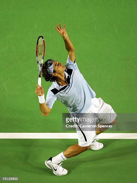Roger Federer of Switzerland serves during his men's final match against Fernando Gonzalez of Chile on day fourteen of the Australian Open 2007 at...
