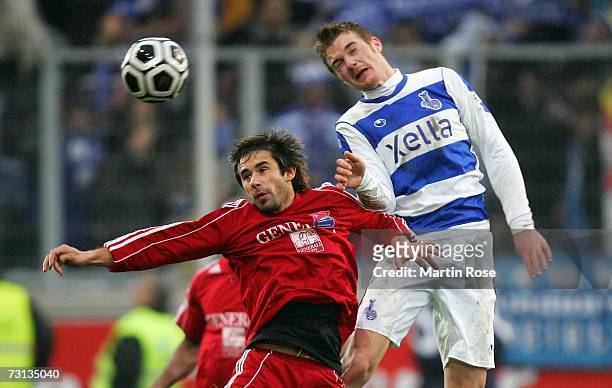 Ivica Majstorovic of Unterhaching and Klemen Lavric of Duisburg head for the ball during the Second Bundesliga match between MSV Duisburg and Spvgg...