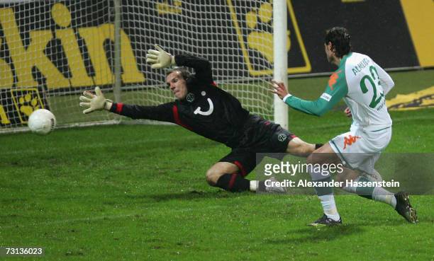 Hugo Almeida of Bremen scores the third goal whilst keeper Robert Enke of Hanover attempts to save, during the Bundesliga match between Werder Bremen...