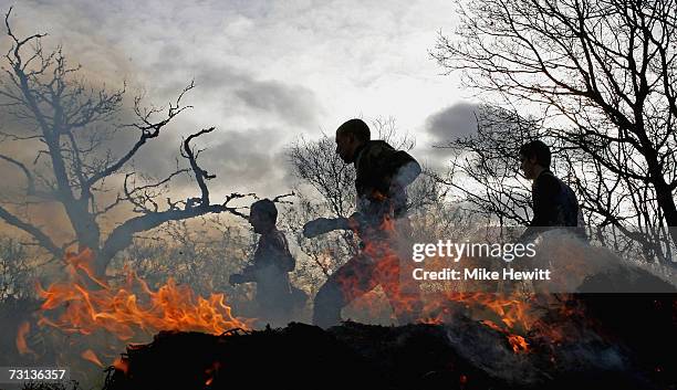 Competitors run through fire during the Tough Guy Challenge on January 28, 2007 near Wolverhampton, England.