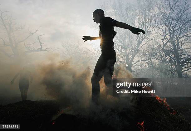 Competitor runs through fire during the Tough Guy Challenge on January 28, 2007 near Wolverhampton, England.