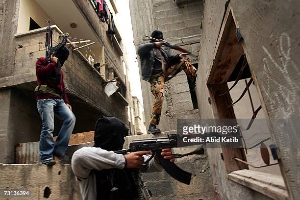 Masked Palestinian gunmen from Fatah take their position during clashes with Hamas members on January 28, 2007 in Jabalia, in the northern Gaza...