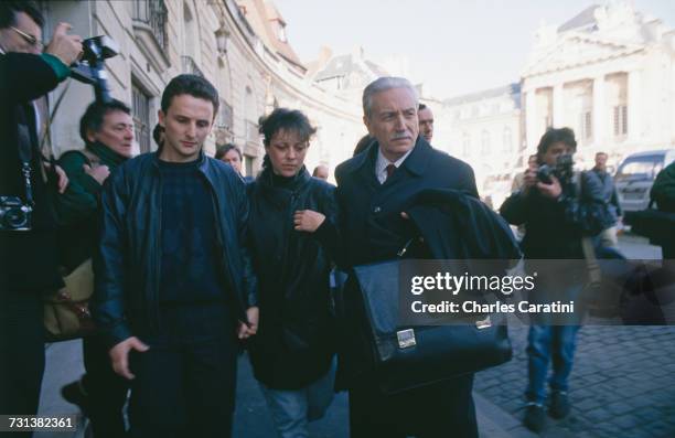 Jean-Marie Villemin and his wife, Christine, with their lawyer, Henri-René Garaud, on their way to testify in the case of the murder of their four...