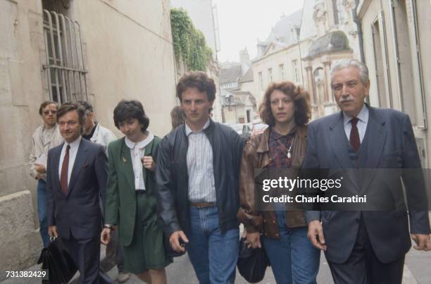 Jean-Marie Villemin and his wife, Christine , with their lawyer, Henri-René Garaud , on their way to testify in the case of the murder of their four...