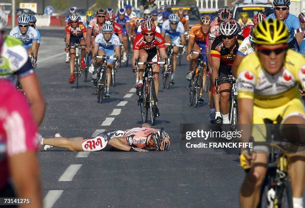 Belgian Tom Steels lies on the ground after falling at the finishing line during the second stage of the 6th edition of the Tour of Qatar cycling...