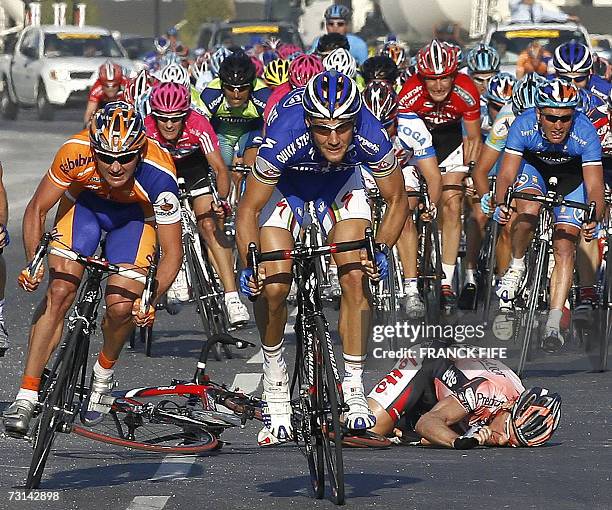 Belgian Tom Steels falls behind Australian Graeme Brown as Belgian Tom Boonen approaches the finishing line during the second stage of the 6th...