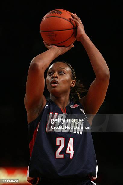 Charde Houston of the University of Connecticut Huskies shoots against the St. John's University Red Storm at Madison Square Garden on January 21,...