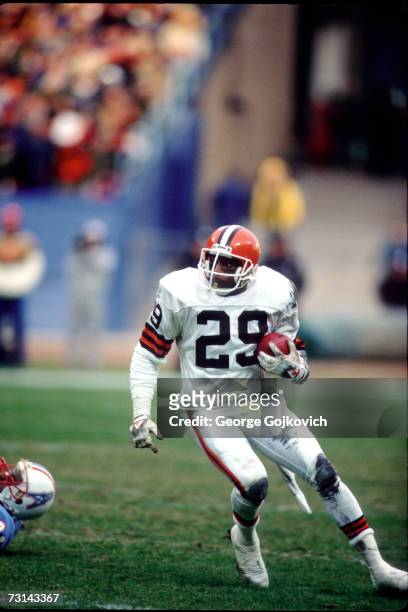 Defensive back Hanford Dixon of the Cleveland Browns runs with the football after intercepting a pass against the Houston Oilers at Municipal Stadium...