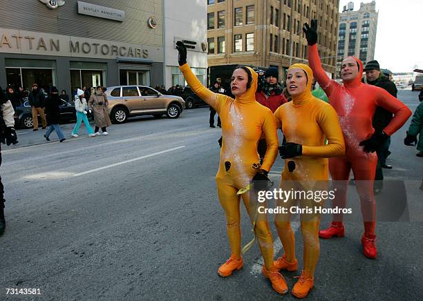 Members of the GROUNDED Aerial Dance Theater hail a taxi immediately after a performance to announce the arrival of the Microsoft Vista operating...