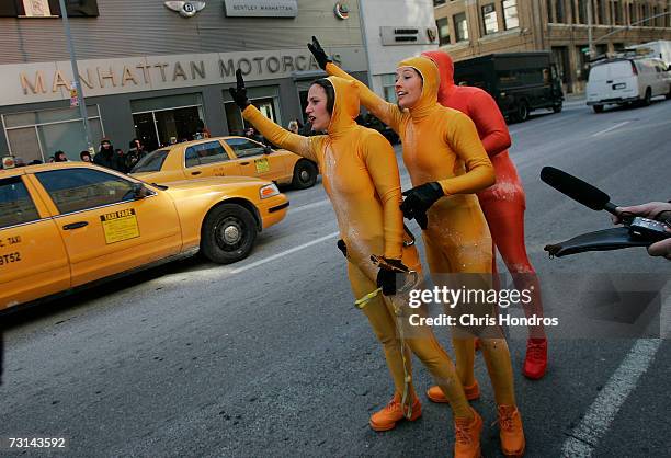 Members of the GROUNDED Aerial Dance Theater hail a taxi immediately after a performance to announce the arrival of the Microsoft Vista operating...