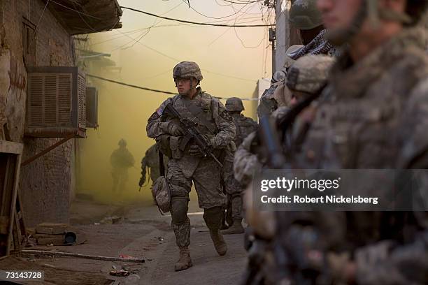 In a combined effort to disrupt Sunni insurgents and Shia militias in the Haifa Street district, US Army soldiers from 1st Platoon, Bravo Company,...