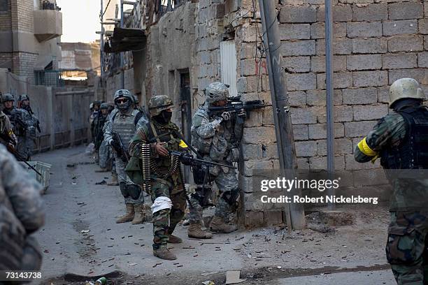 In a combined effort to disrupt Sunni insurgents and Shia militias in the Haifa Street district, US Army soldiers from 1st Platoon, Bravo Company,...