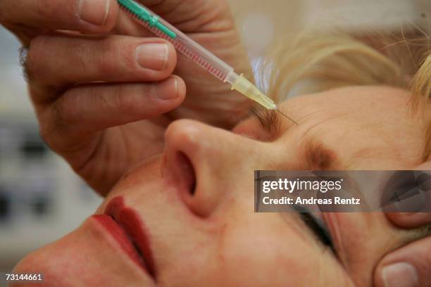 Doctor injects a patient with Botox at a cosmetic treatment center January 29, 2007 in Berlin, Germany. Over 50,000 people in Germany receive the...