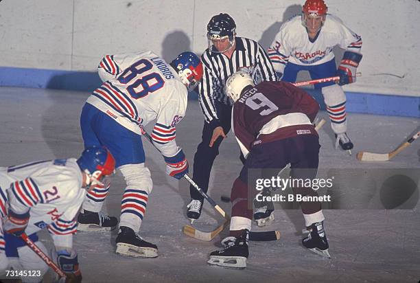 Canadian professional ice hockey player Eric Lindros of the Ontario Hockey League's Oshawa Generals faces off against Mike Ricci of the Peterborough...