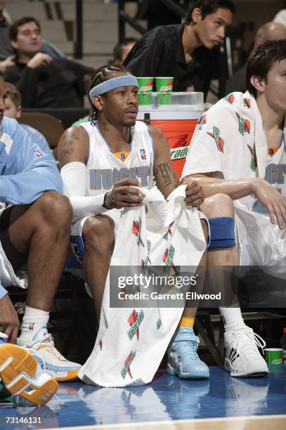 Allen Iverson of the Denver Nuggets sits on the bench during the NBA game against the Boston Celtics on December 26, 2006 at the Pepsi Center in...