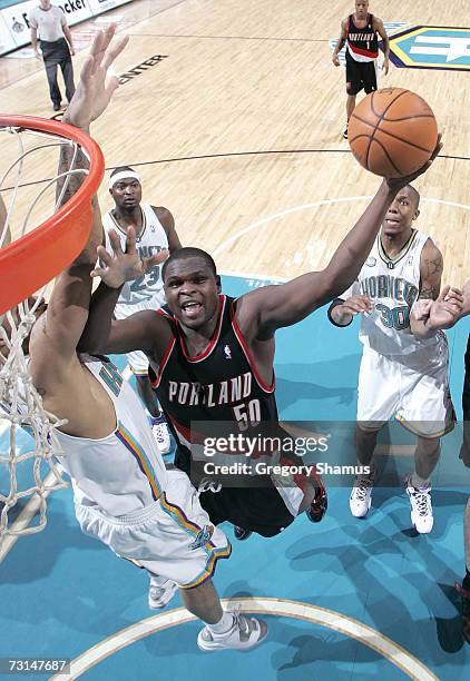 Zach Randolph of the Portland Trail Blazers gets to the basket past Tyson Chandler of the New Orleans/Oklahoma City Hornets on January 29, 2007 at...