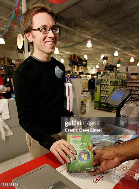 James Booth buys a copy of Vista during a software release party for the operating system at a Comp USA store, January 30 in Houston, Texas. More...