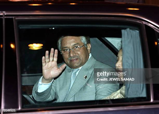 Pakistani President Pervez Musharraf waves from a car as First Lady Sehba Musharraf looks on upon their arrival at Halim airport in Jakarta 30...