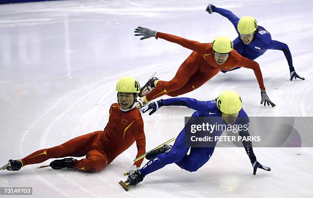 China's Li Ye crashes on the last corner after leading Korean Ahn Hyun-Soo his teammate, Hu Ze and Korea's Song Kyung-Taek in the Men's 500m Short...