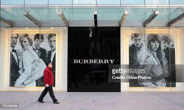 Man walks past a Burberry store on January 30, 2007 in Nanjing of Jiangsu Province, China. British luxury goods retailer Burberry has recently...