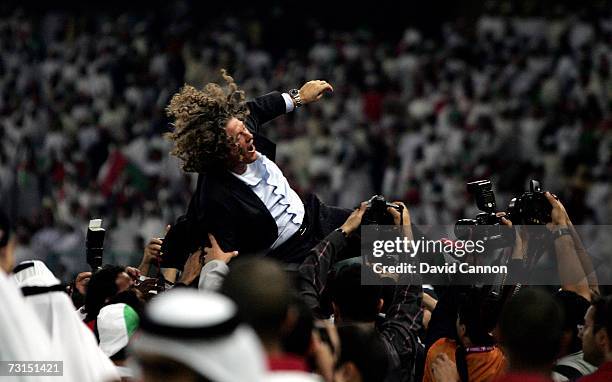 The United Emirates team lift their coach Bruno Metsu after the final of the Arabian Gulf Cup between United Arab Emirates and Oman, in the Zayed...