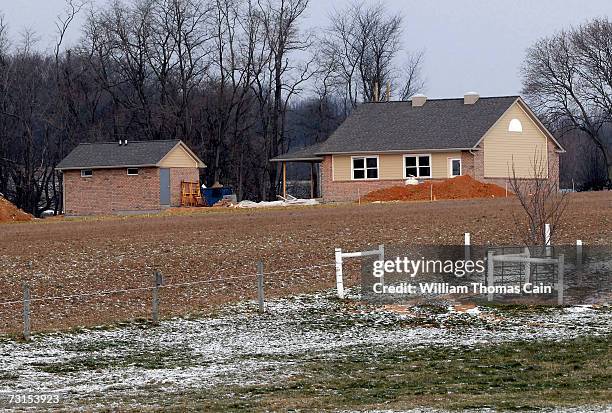 New schoolhouse is under construction by members of the Amish community during the rebuilding a few hundred yards from the site of the murder of five...