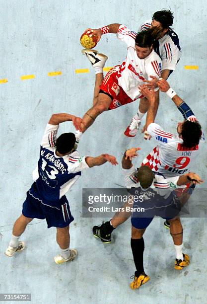 Ivano Balic of Croatia in action against Nikola Karabatic, Bertrand Gille and Didier Dinart of France during the IHF World Championship quarter final...