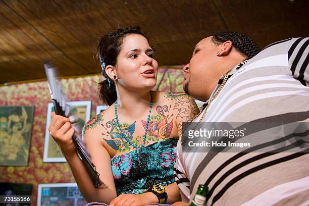 young couple socializing at local bar - hot puerto rican women stock-fotos und bilder