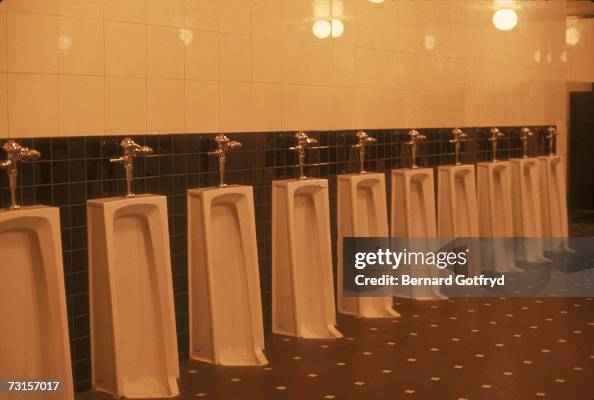 First Urinal A row of urinals in a men's public bathroom, 1970s. News Photo - Getty ...