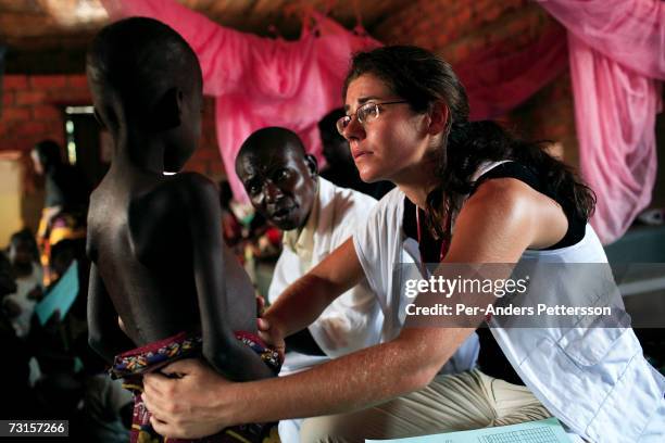 Chris Lenzen, a German medical doctor, checks on a sick patient on December 10, 2005 in Dubie, Katanga Province in Congo, Democratic Republic of the...