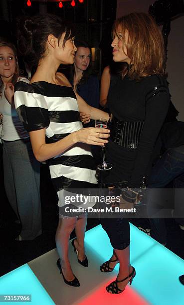 Thandie Newton and Eva Mendes attend the launch party for new range of bags created by Mulberry for Giles, at Harvey Nichols on January 30, 2007 in...